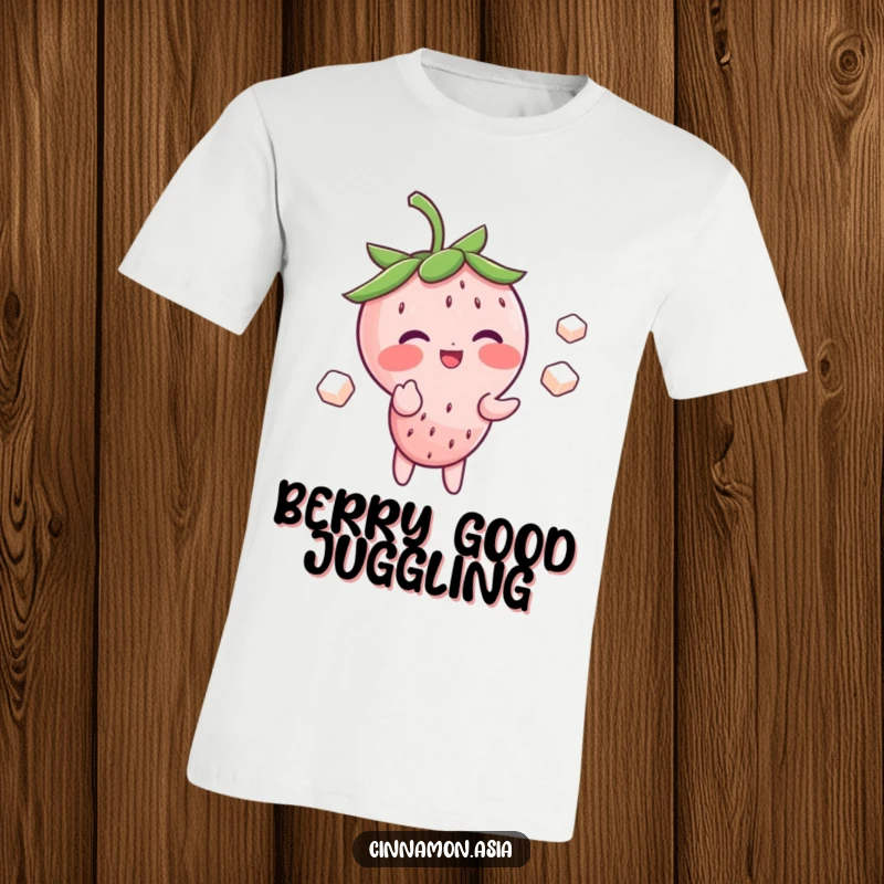 Funny t-shirt of a blushing strawberry character giggling adorably while juggling three small sugar cubes with ease.